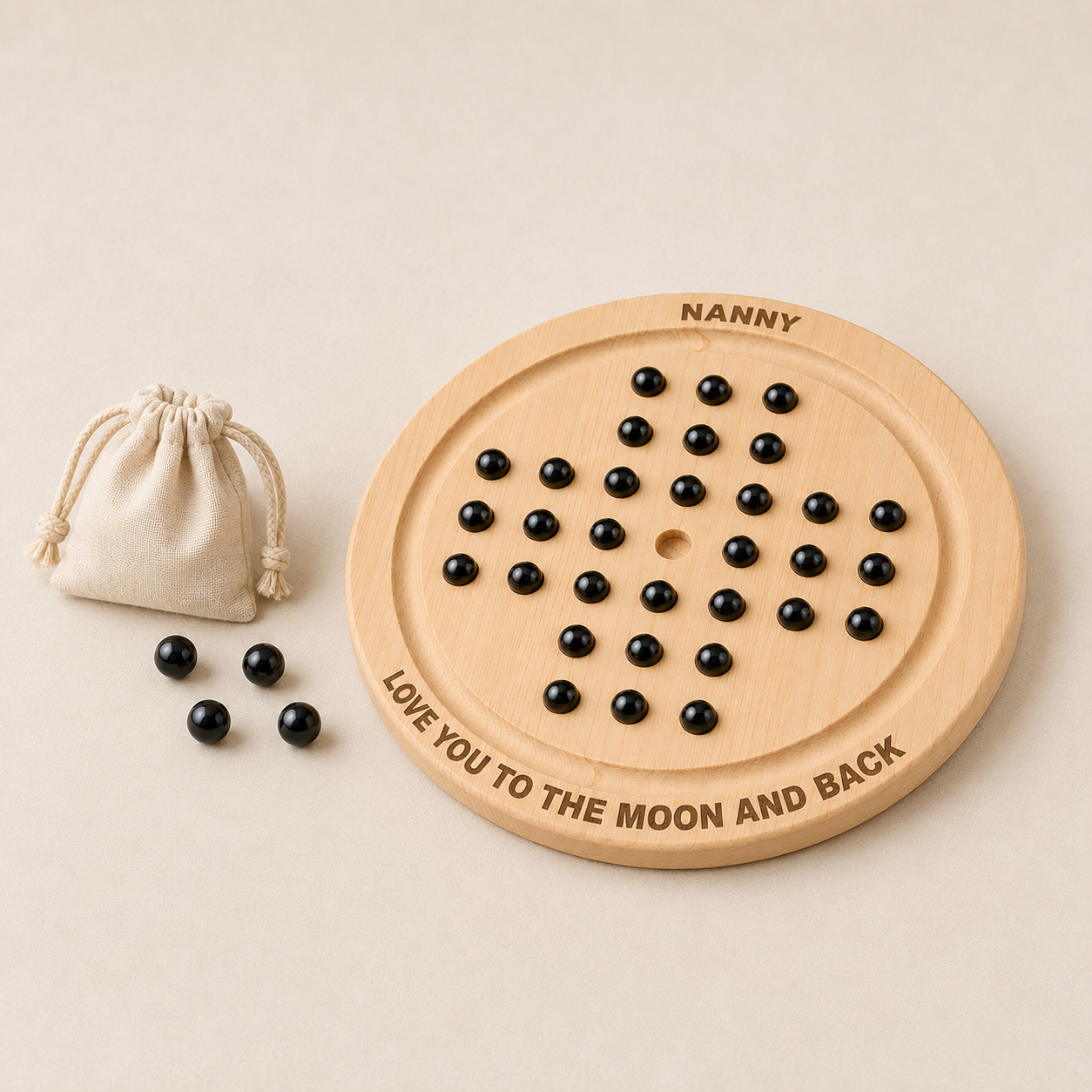 Personalised wooden solitaire board game with cotton bag and black marbles