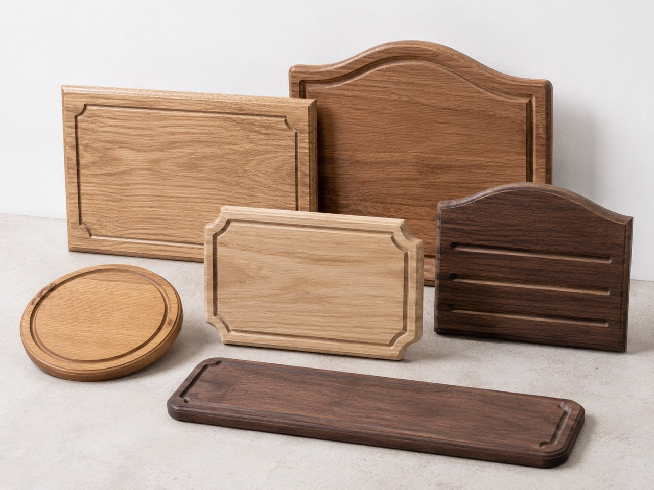 Finished wooden sample panels and routed boards in different wood tones